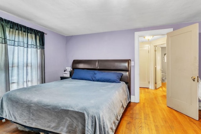 bedroom with light wood-type flooring