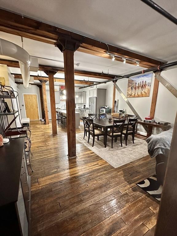 881 E 1st St Unit 303, Boston, MA 02127 - dining area with wood-type flooring and decorative columns