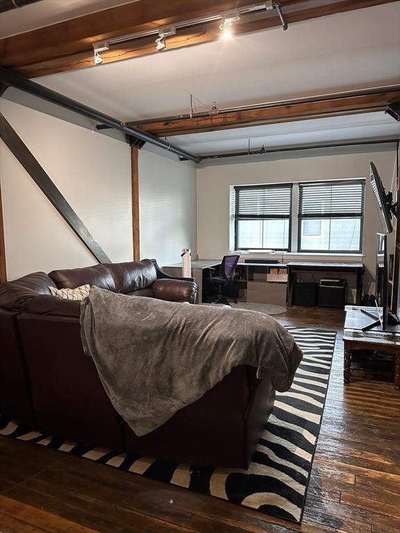881 E 1st St Unit 303, Boston, MA 02127 - living area featuring dark wood-type flooring and a desk