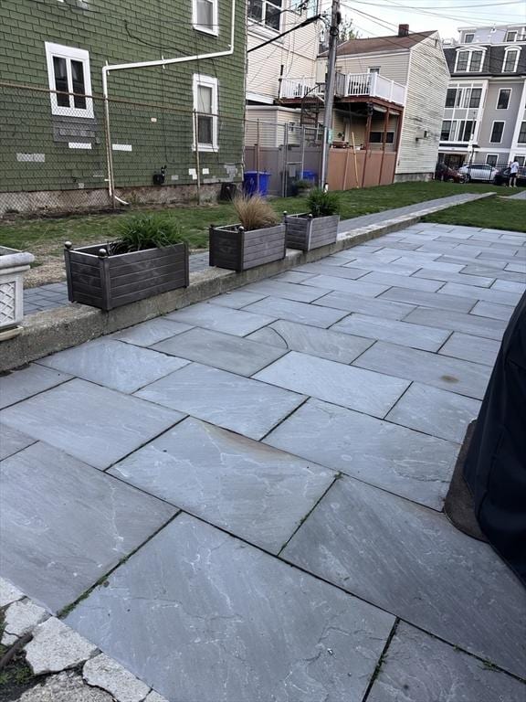 881 E 1st St Unit 303, Boston, MA 02127 - view of patio / terrace with fence and a garden