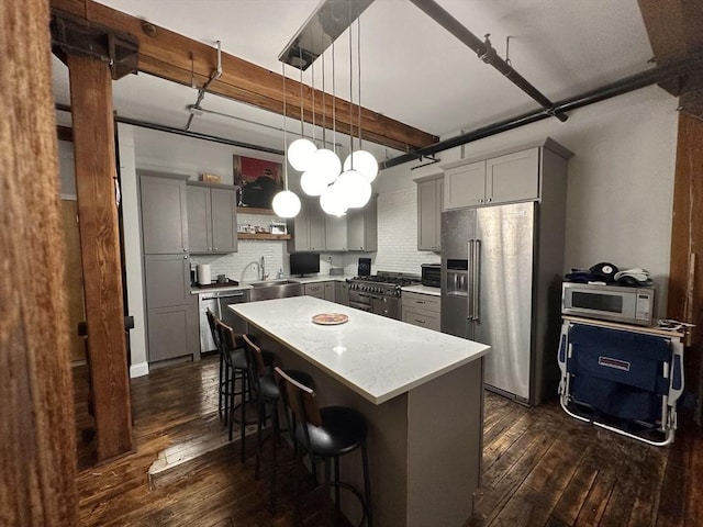881 E 1st St Unit 303, Boston, MA 02127 - kitchen featuring high end appliances, gray cabinetry, dark wood finished floors, and a sink