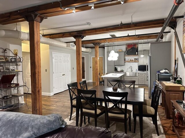 881 E 1st St Unit 303, Boston, MA 02127 - dining space featuring dark wood-style flooring, baseboards, and beamed ceiling