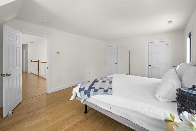 bedroom with light hardwood / wood-style floors