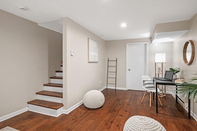 sitting room with stairs, recessed lighting, wood finished floors, and baseboards