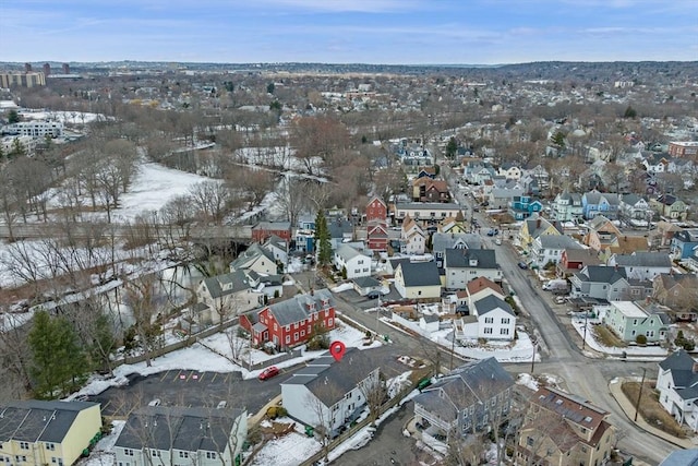 snowy aerial view with a residential view