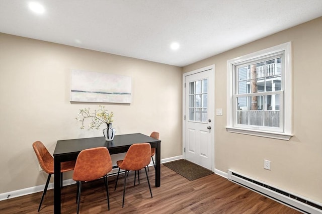 dining area featuring recessed lighting, baseboards, dark wood-type flooring, and baseboard heating