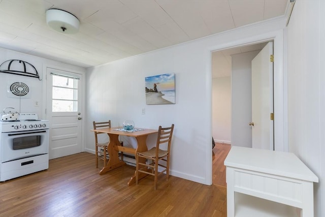 124 Skiff Ave Unit A-11, Tisbury, MA 02568 - kitchen with white range oven, wood finished floors, and crown molding