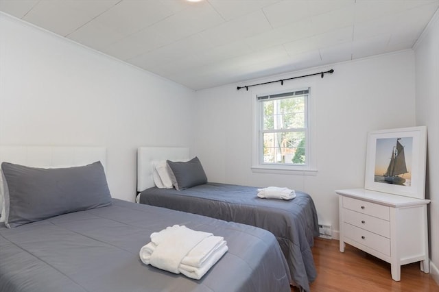 124 Skiff Ave Unit A-11, Tisbury, MA 02568 - bedroom with wood finished floors and ornamental molding