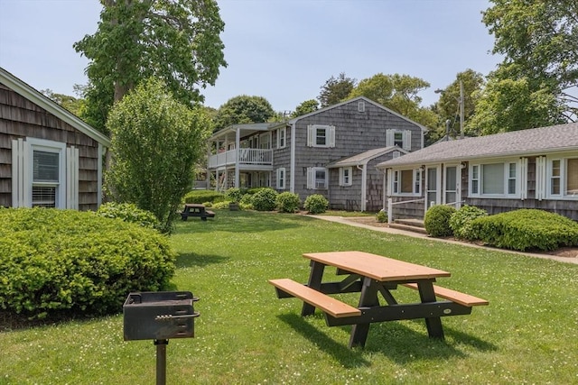 124 Skiff Ave Unit A-11, Tisbury, MA 02568 - surrounding community with a lawn