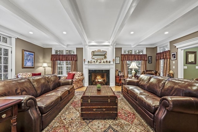 living room featuring a large fireplace, recessed lighting, beam ceiling, and crown molding