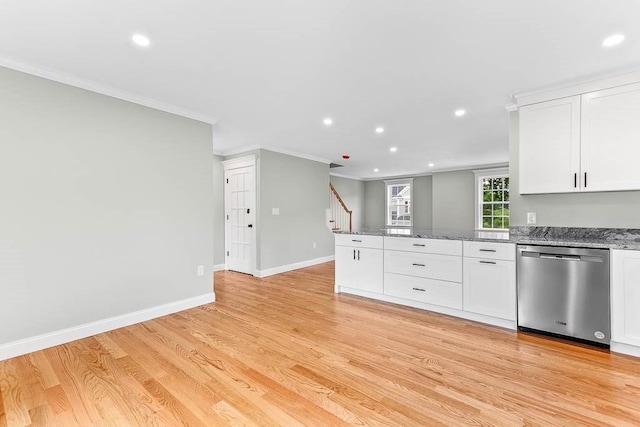 kitchen featuring light stone counters, crown molding, light wood-type flooring, stainless steel dishwasher, and white cabinets