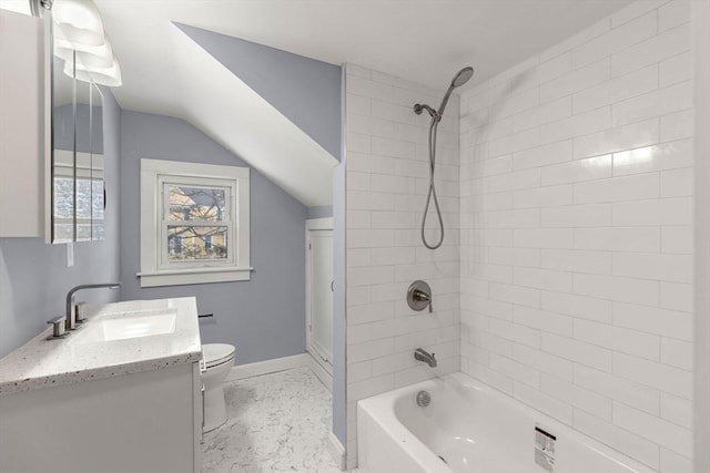 bathroom with lofted ceiling, shower / bath combination, toilet, vanity, and baseboards