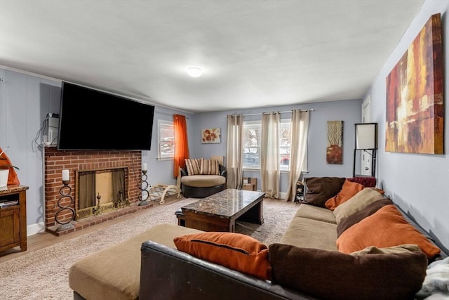 living area featuring a fireplace and light wood finished floors