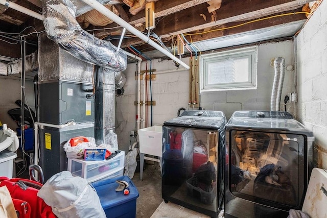 clothes washing area featuring laundry area and separate washer and dryer