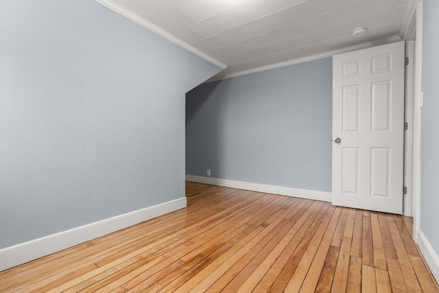 bonus room featuring light wood-type flooring and baseboards