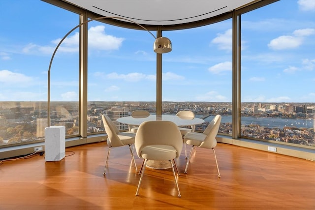 sunroom / solarium featuring a view of city