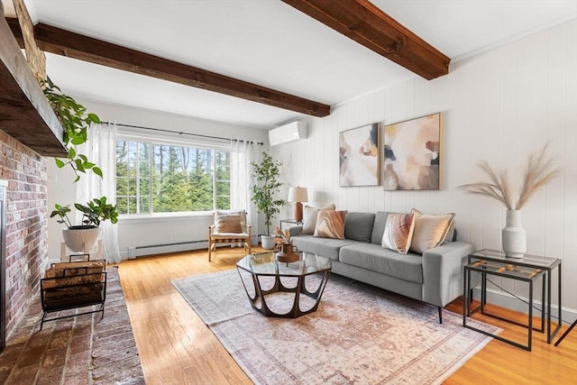 living area featuring a baseboard radiator, wood finished floors, a wall unit AC, and beamed ceiling
