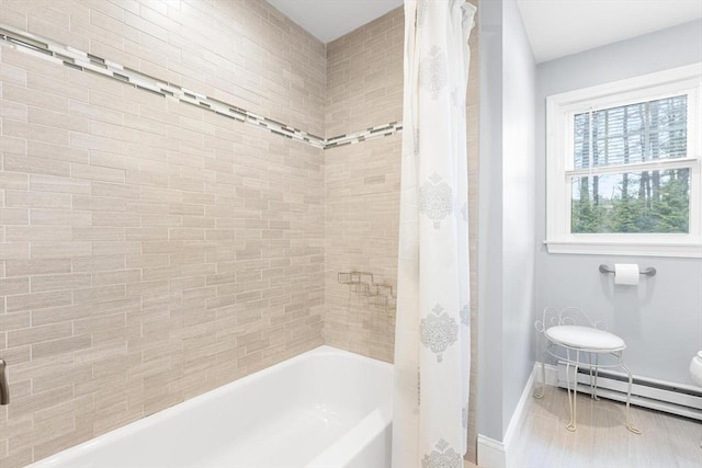 bathroom with baseboards, shower / bathtub combination with curtain, and a baseboard radiator