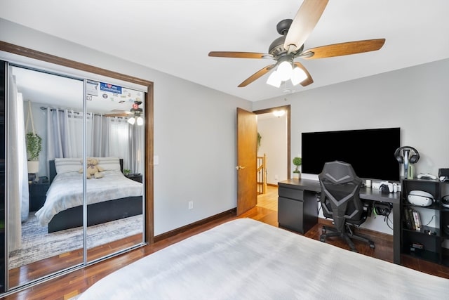 bedroom with ceiling fan, a closet, and wood-type flooring