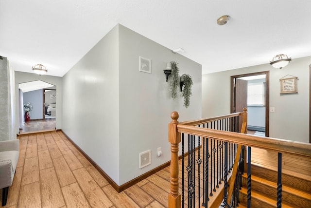 hall with wood-type flooring