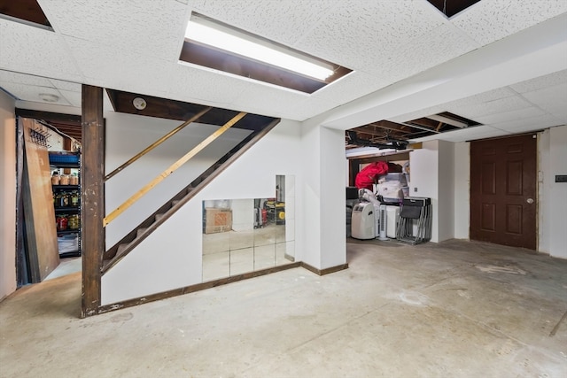 basement featuring a paneled ceiling