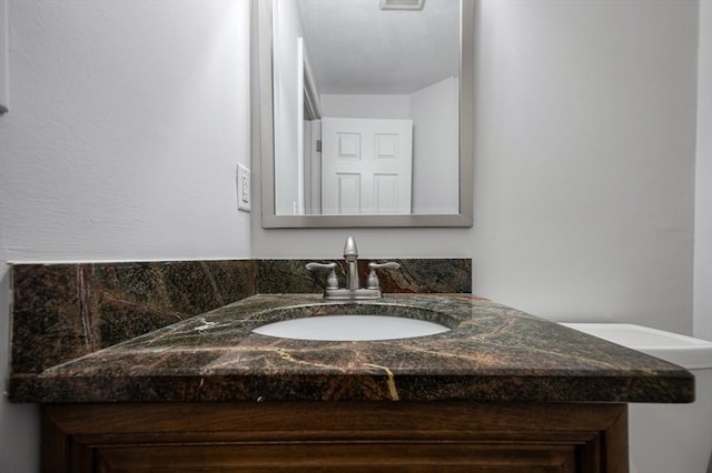 bathroom with visible vents and vanity