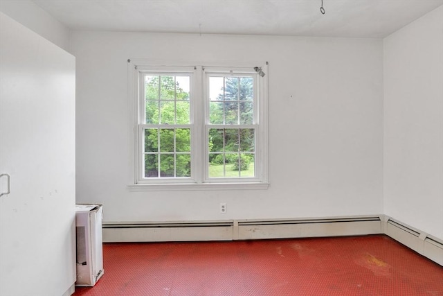 45 Alpine Dr, Southbridge, MA 01550 - empty room with carpet floors, plenty of natural light, and a baseboard radiator