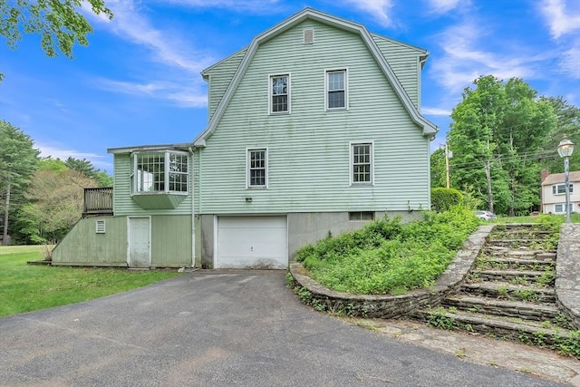 45 Alpine Dr, Southbridge, MA 01550 - view of side of property with driveway, a garage, and a gambrel roof