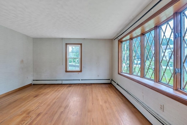 45 Alpine Dr, Southbridge, MA 01550 - empty room featuring a baseboard heating unit, light wood-style flooring, and baseboards
