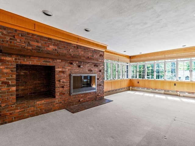 unfurnished living room featuring a textured ceiling, a healthy amount of sunlight, and carpet floors