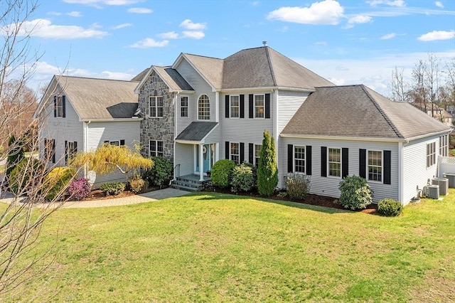 2 Rich Rd, Milford, MA 01757 - colonial-style house featuring a front yard and cooling unit