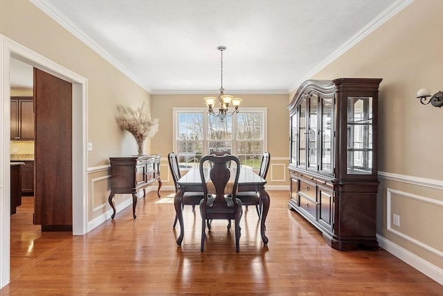 2 Rich Rd, Milford, MA 01757 - dining room featuring light wood-style floors, crown molding, and a notable chandelier