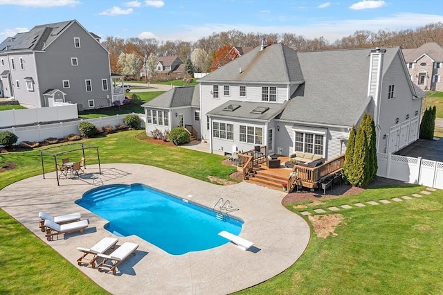 2 Rich Rd, Milford, MA 01757 - back of house with a deck, a fenced backyard, a fenced in pool, a yard, and a residential view