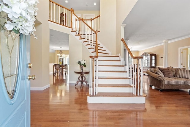 2 Rich Rd, Milford, MA 01757 - foyer featuring baseboards, a notable chandelier, wood finished floors, and stairway