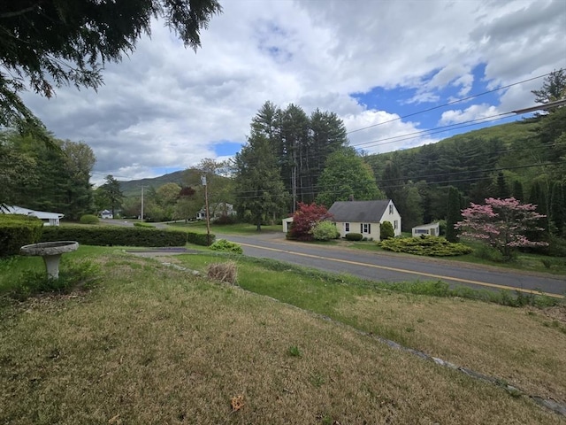 view of asphalt street with a mountain view