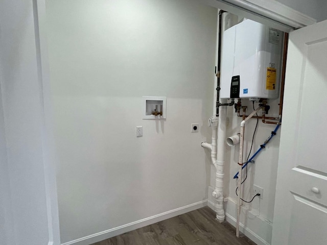 laundry room featuring hookup for an electric dryer, washer hookup, dark hardwood / wood-style floors, and water heater