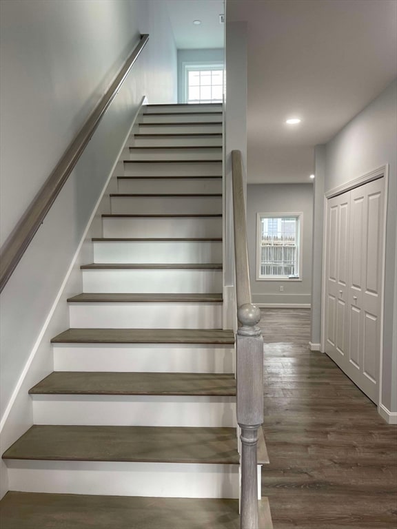 stairs featuring hardwood / wood-style flooring