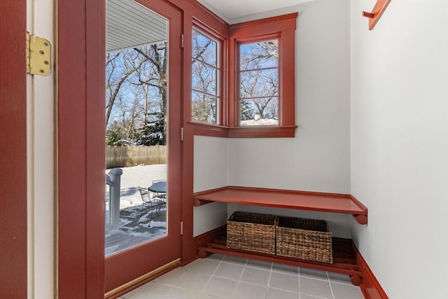 entryway featuring tile patterned floors and baseboards