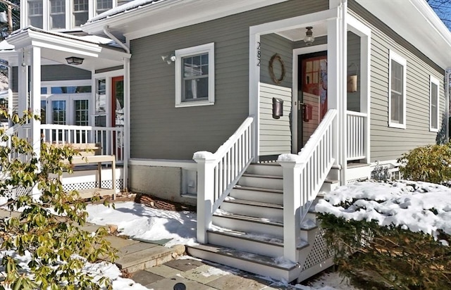 doorway to property featuring covered porch