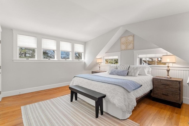 bedroom featuring baseboards and wood finished floors