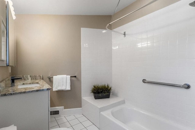 bathroom featuring shower / bath combination, vanity, baseboards, and tile patterned floors