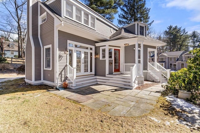 bungalow-style home featuring french doors