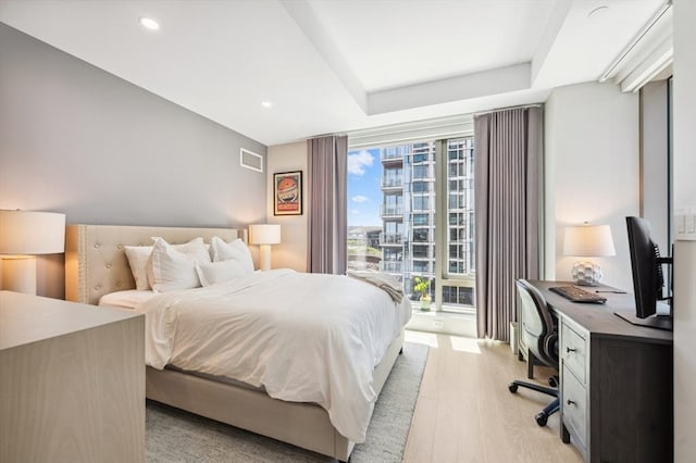 133 Seaport Blvd Unit 823, Boston, MA 02210 - bedroom featuring a wall of windows, an office area, light wood-style floors, and recessed lighting