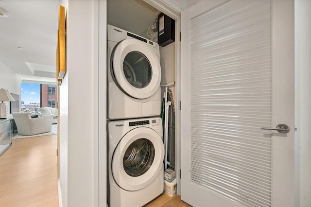 133 Seaport Blvd Unit 823, Boston, MA 02210 - laundry room with stacked washer and clothes dryer and wood finished floors