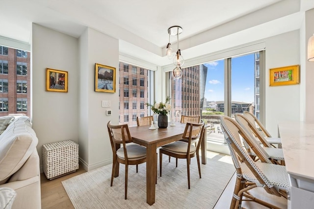 133 Seaport Blvd Unit 823, Boston, MA 02210 - dining room featuring light wood finished floors and baseboards