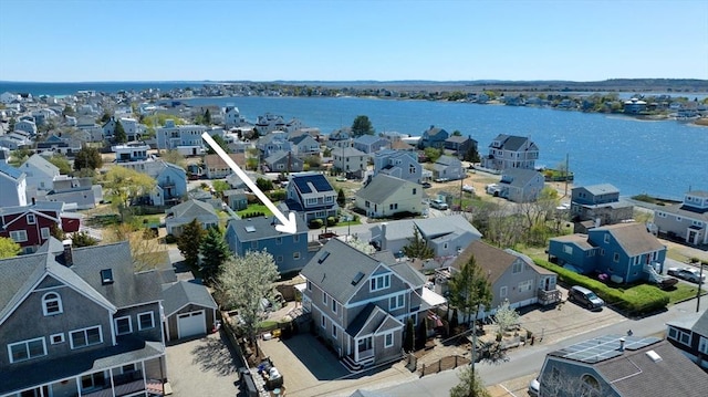 birds eye view of property with a residential view and a water view