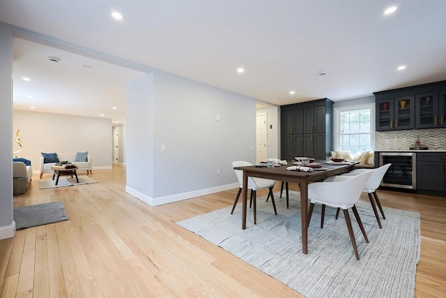 44 Dean Rd, Wayland, MA 01778 - dining area with wine cooler, light wood-style floors, baseboards, and recessed lighting