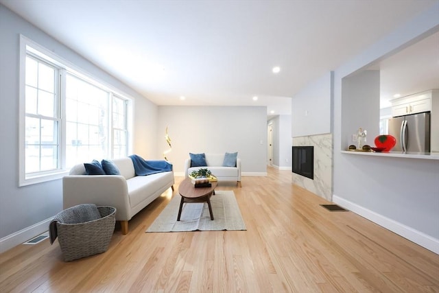 44 Dean Rd, Wayland, MA 01778 - living room with light wood-style flooring, a fireplace, baseboards, and recessed lighting