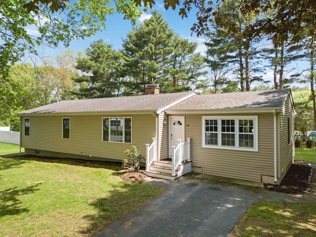 44 Dean Rd, Wayland, MA 01778 - view of front facade featuring a chimney, a front lawn, and a shingled roof