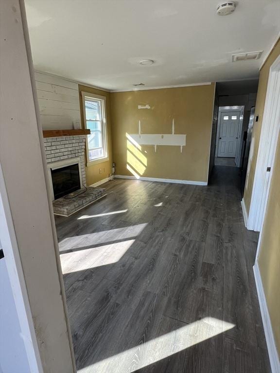 83 Shore Ave, Wareham, MA 02571 - unfurnished living room featuring wood finished floors, baseboards, and a fireplace